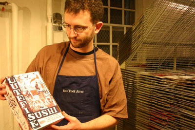 Proud Poppa Kevin Cannon displays the fresh off the press Lutefisk Sushi Volume C Box